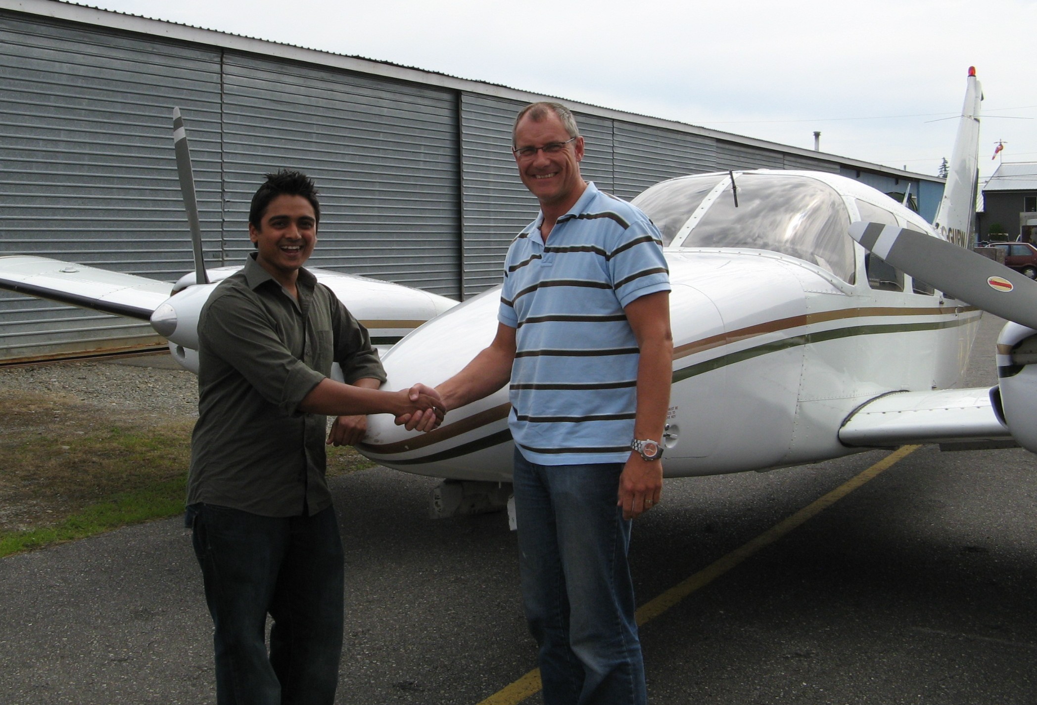 Commercial Pilot Nikhil Dongare with Pilot Examiner Matt Edwards after the successful completion of his Group 1 (Multi-engine) Instrument Rating on August 12, 2008. Langley Flying School.